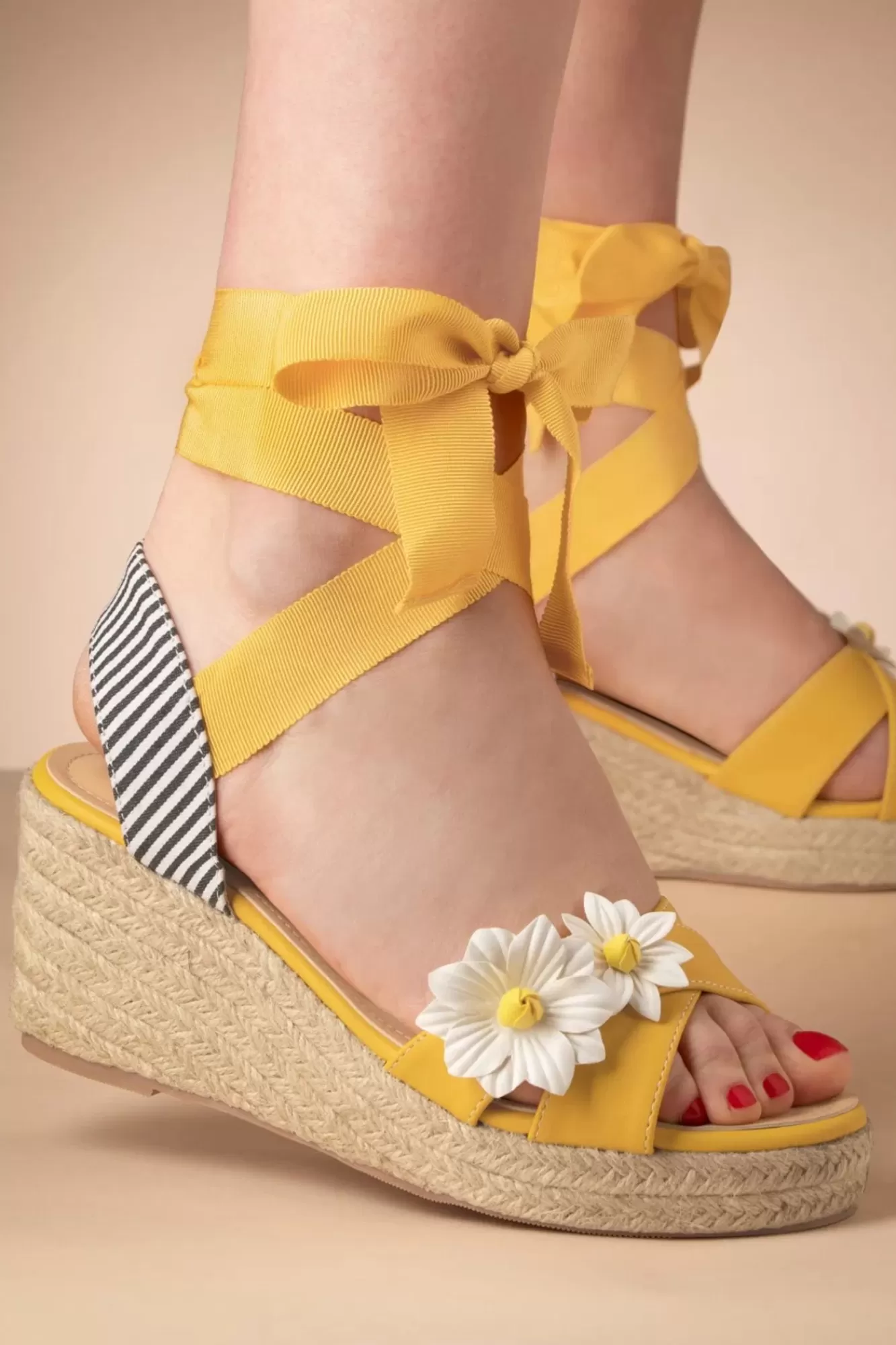 Shop Banned Retro Lady Daisy Wedges In Gelb